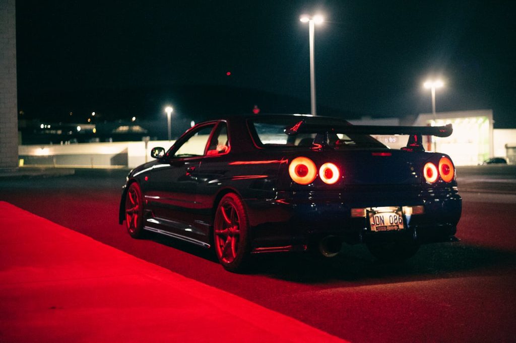 Nissan Skyline GT-R R34 at night, the kind of car you meet at Daikoku PA
